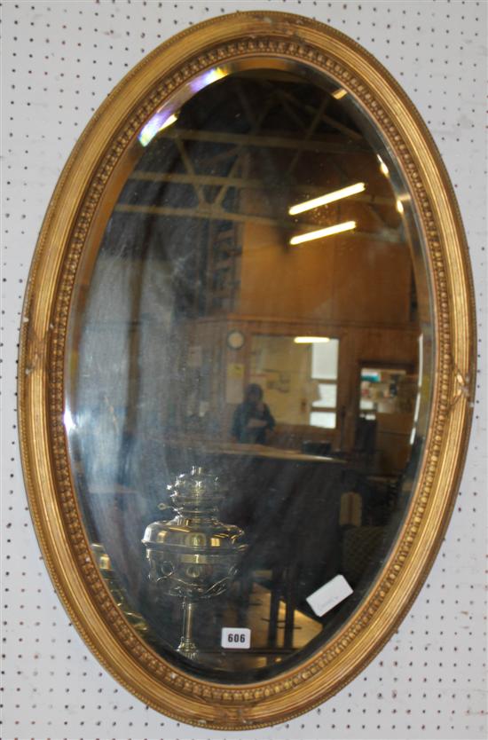 Gilt oval mirror(-)